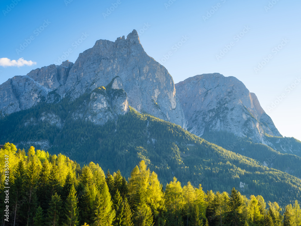 High sharp rocks and forest. Mountain valley at the day time. Natural landscape. Landscape in summer