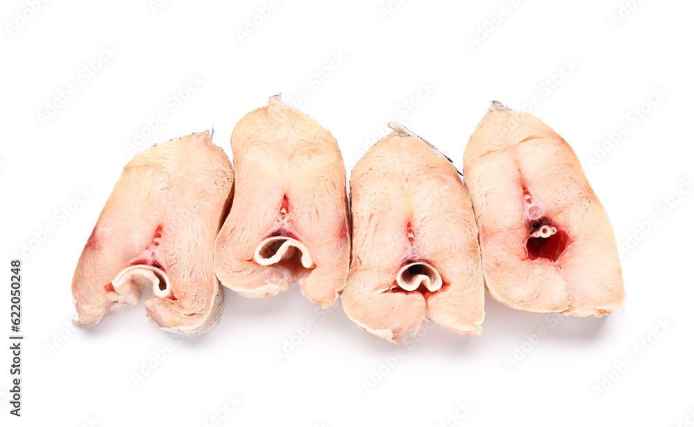 Pieces of raw codfish on white background