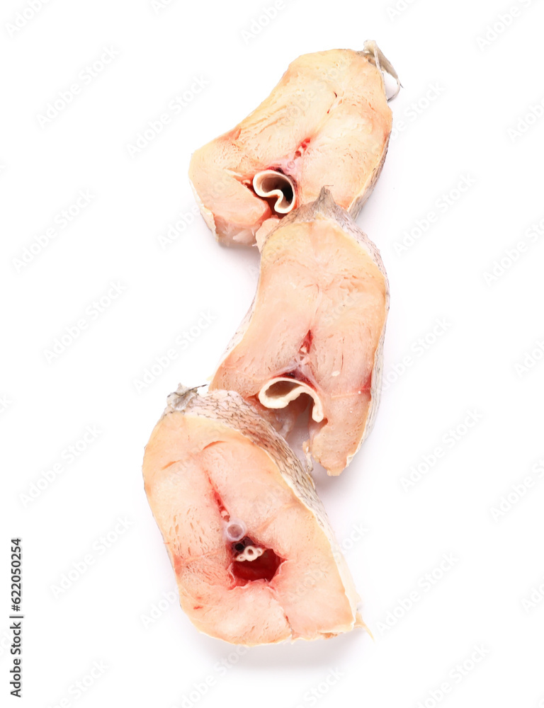 Pieces of raw codfish on white background