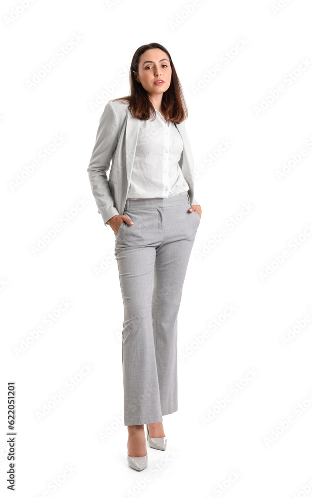 Young woman in stylish suit on white background