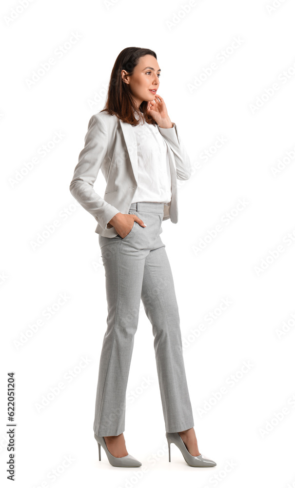 Young woman in stylish suit on white background