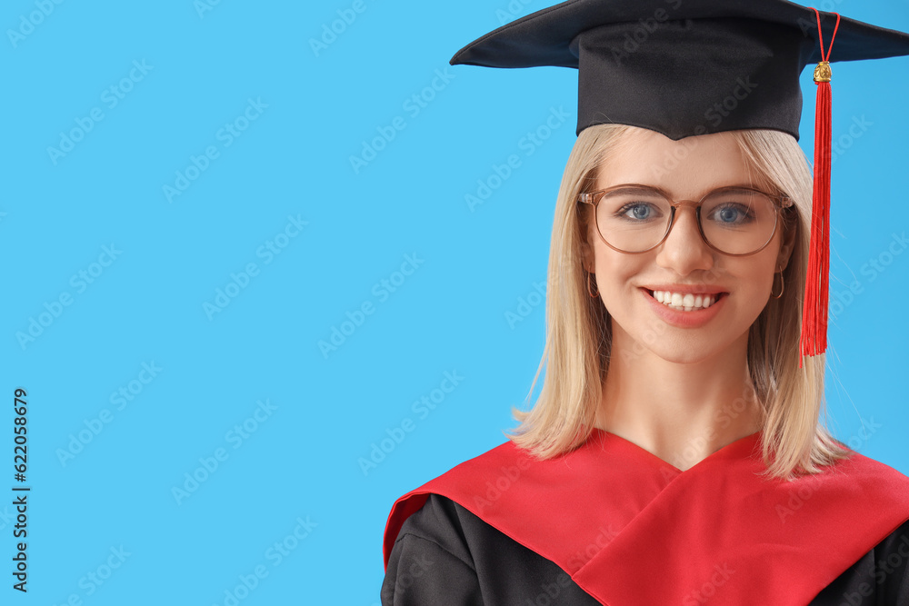 Female graduate student with diploma on blue background, closeup