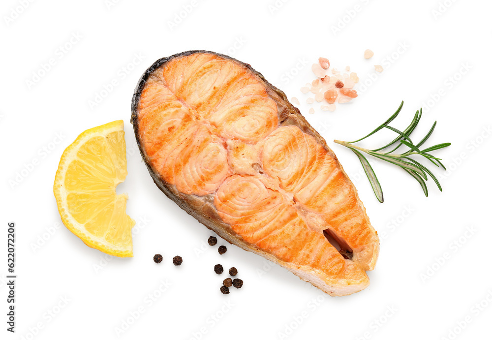 Tasty grilled salmon steak with lemon on white background