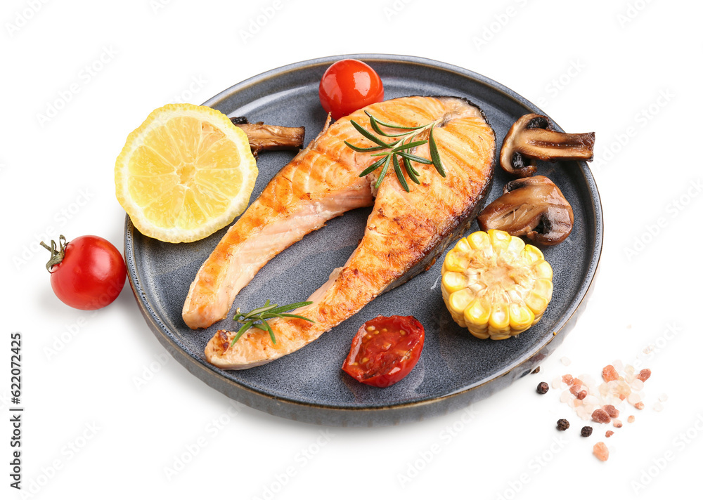 Plate with tasty grilled salmon steak and vegetables on white background