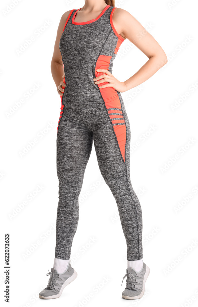 Young woman in sportswear on white background