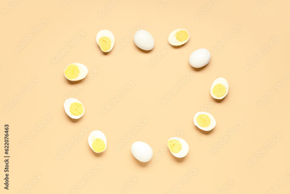 Frame made of tasty boiled eggs on orange background