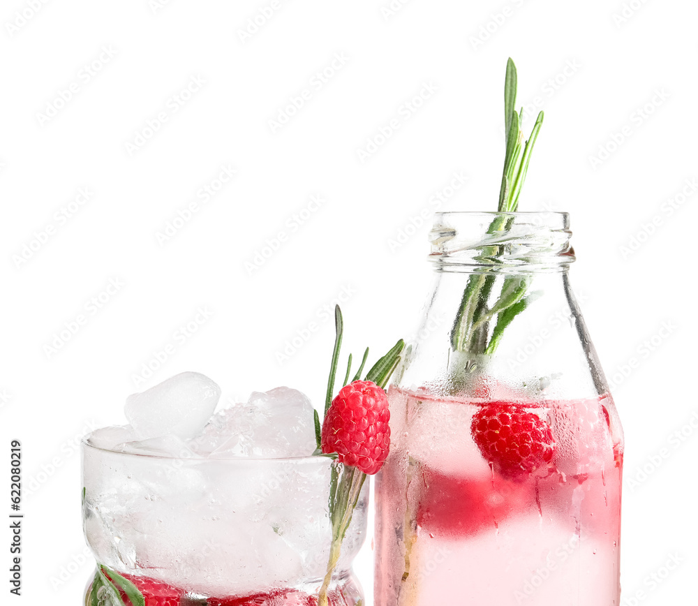 Bottle and glass of fresh raspberry lemonade with rosemary on white background