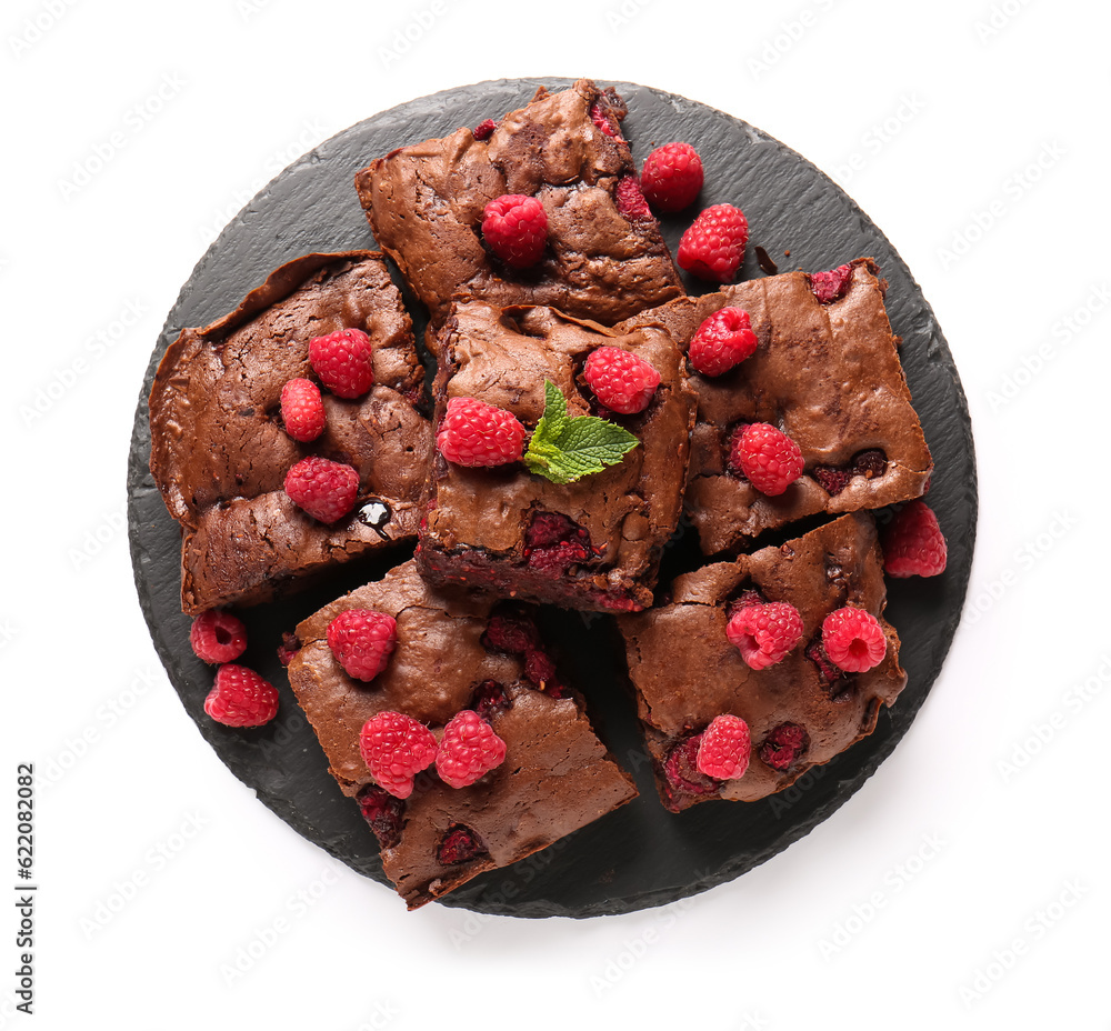 Board with pieces of raspberry chocolate brownie on white background