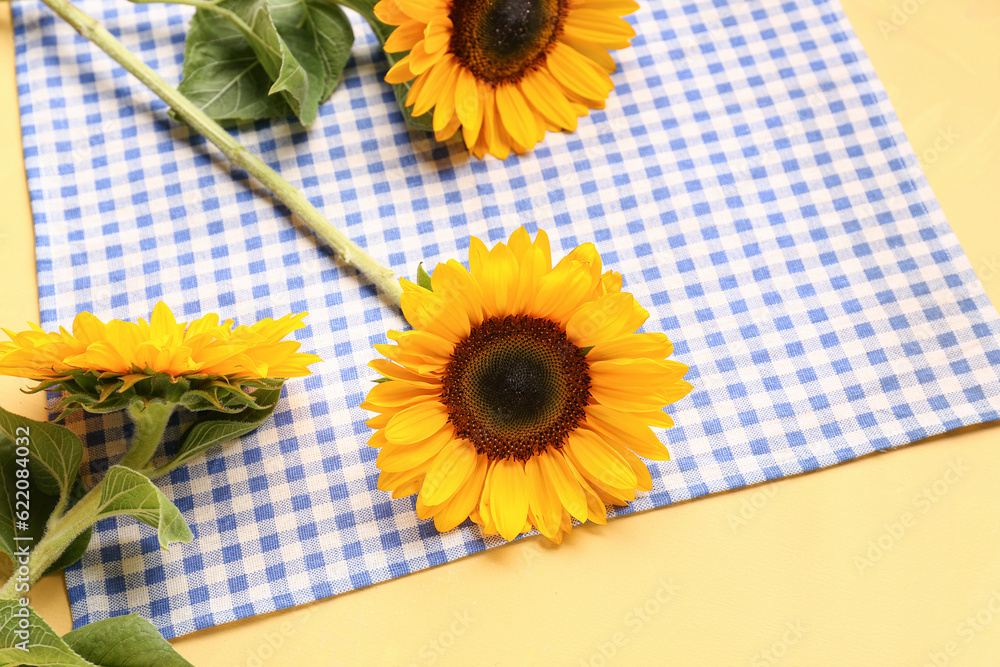 Beautiful sunflowers on yellow background