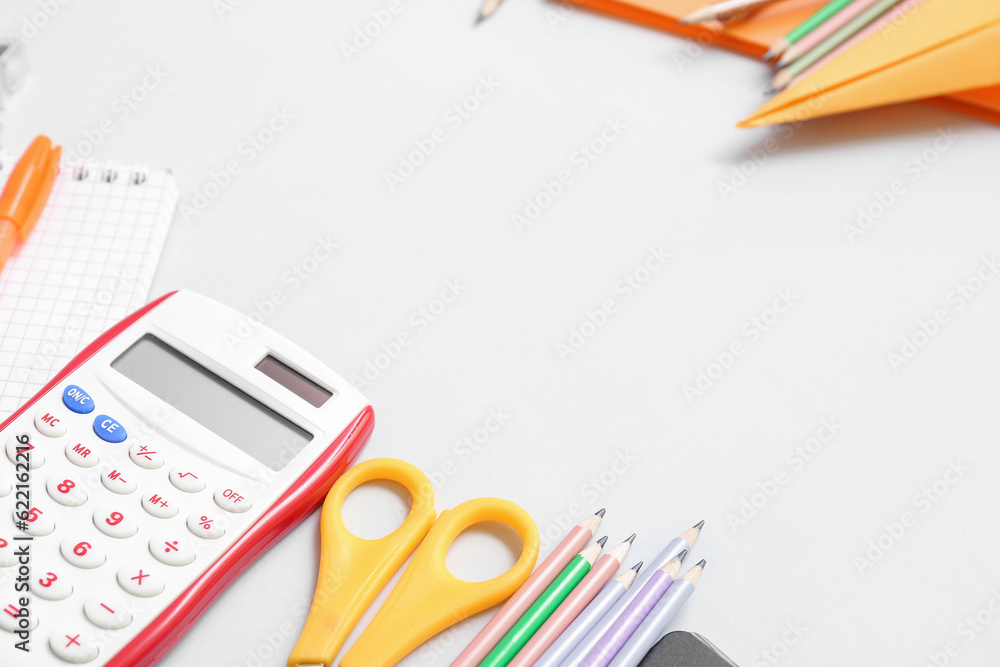 Paper plane and different school stationery on white background, closeup