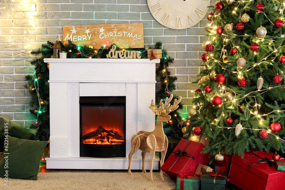 Interior of living room with fireplace, Christmas tree and gift boxes