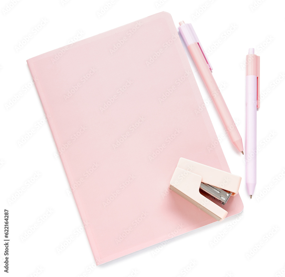 Pink notebook with pens and stapler isolated on white background