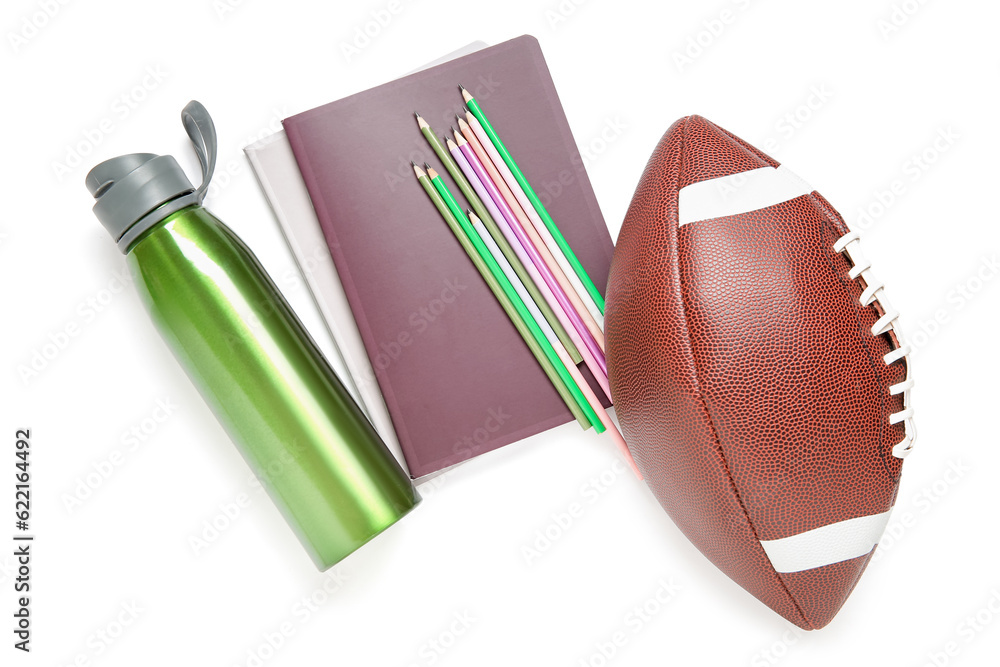 Rugby ball with bottle of water and different stationery isolated on white background