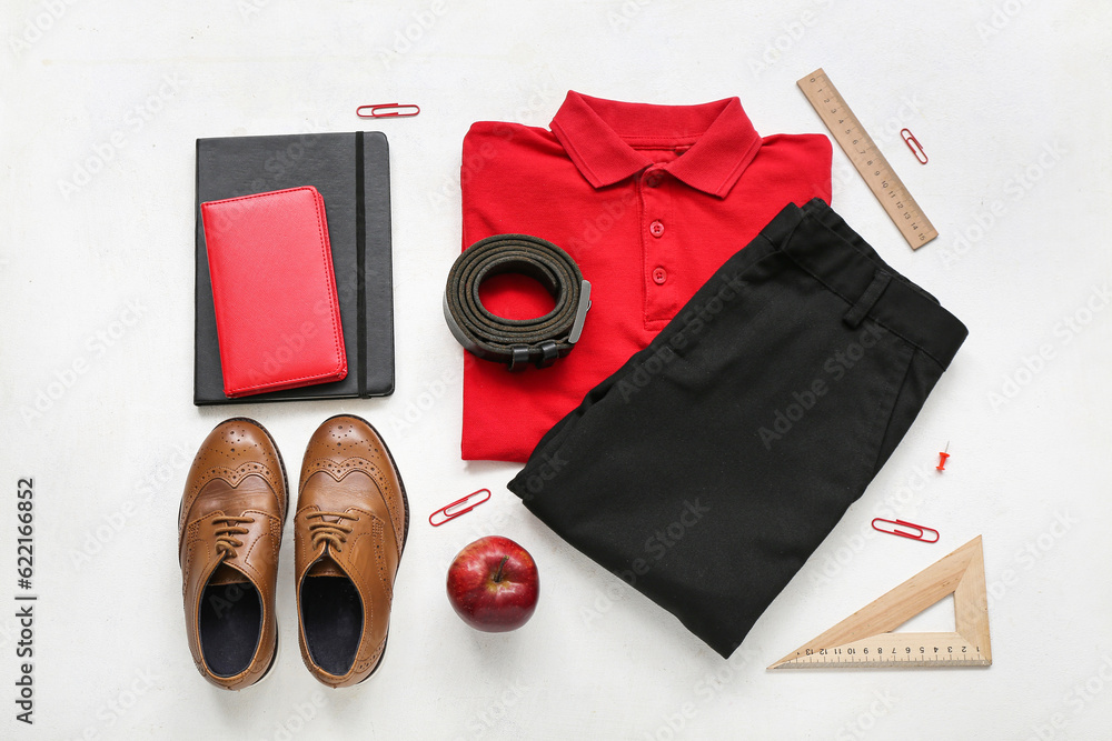 Different stationery and stylish school uniform on white background