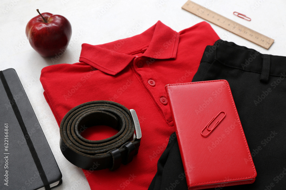 Different stationery and stylish school uniform on white background