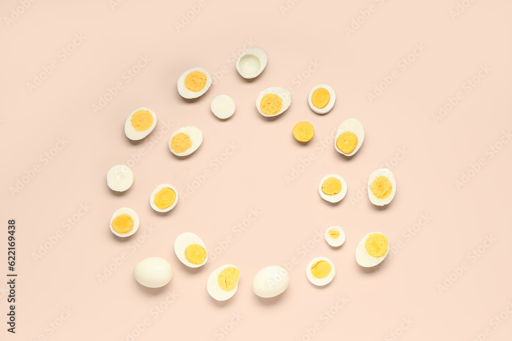 Frame made of tasty boiled eggs on pink background