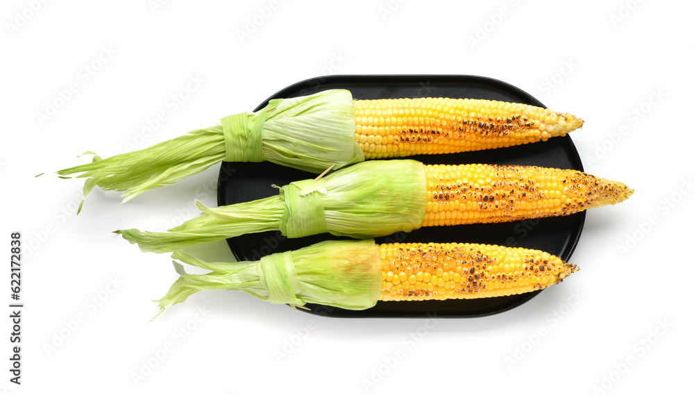 Tray with tasty grilled corn cobs on white background