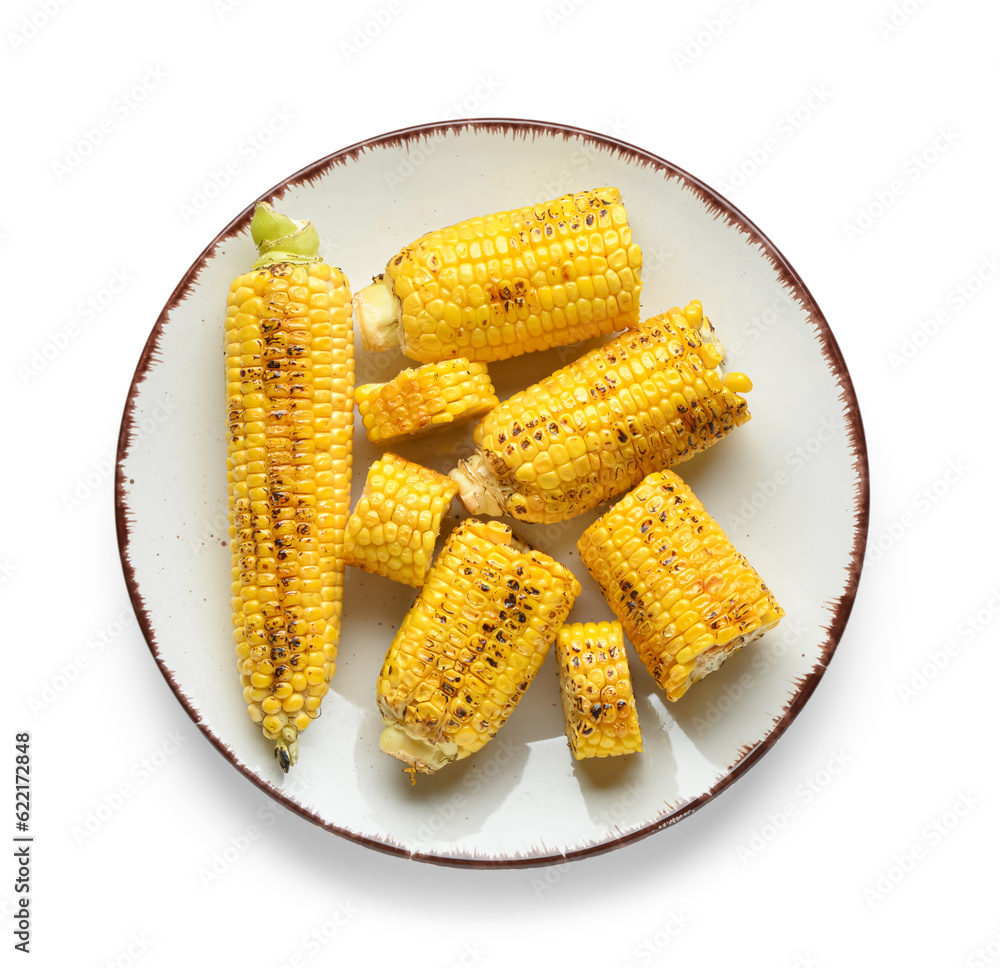 Plate with tasty grilled corn cobs on white background