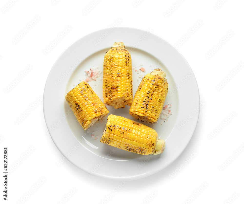 Plate with cut tasty grilled corn cobs on white background