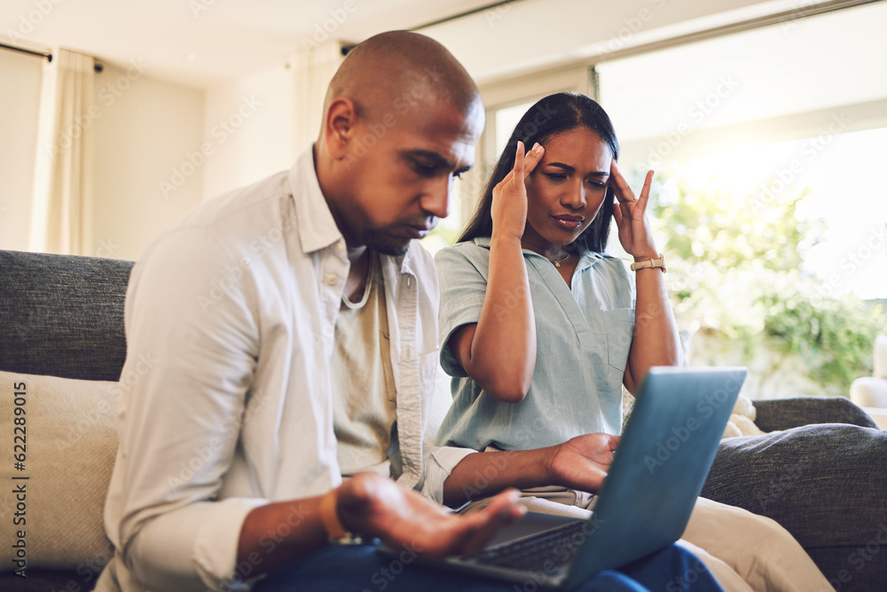 Stress, frustrated and couple on a laptop in the living room of their modern home paying their bills