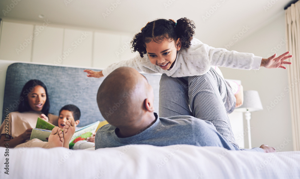 Family home, parents and child playing on a bed together with love, care and security or comfort. Ma