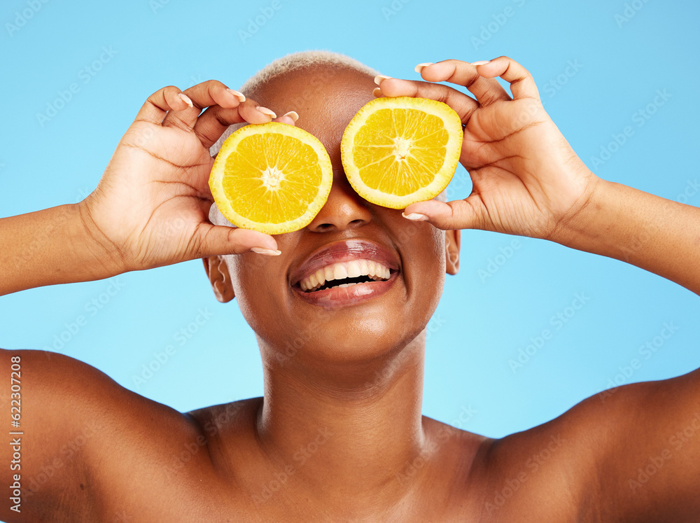 Orange, beauty and smile with a model black woman in studio on a blue background for a facial. Food,