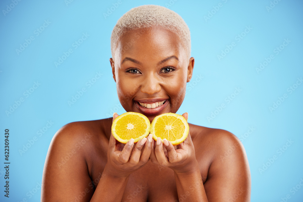 Portrait, skincare and fruit or nutrition with a black woman in studio on a blue background for heal