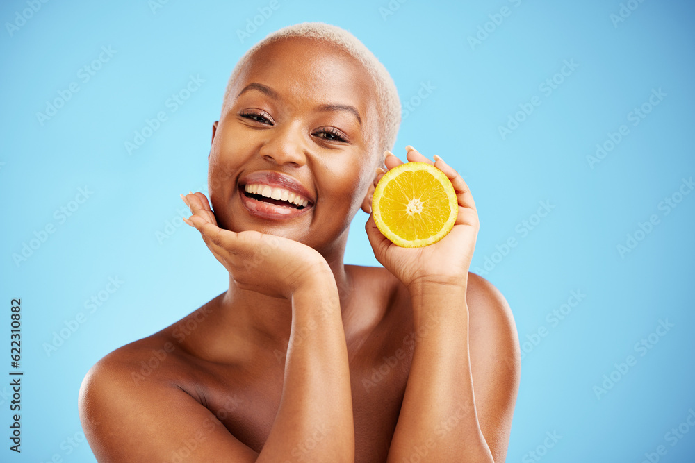 Portrait, beauty and orange with a black woman in studio on a blue background for fruit nutrition. S