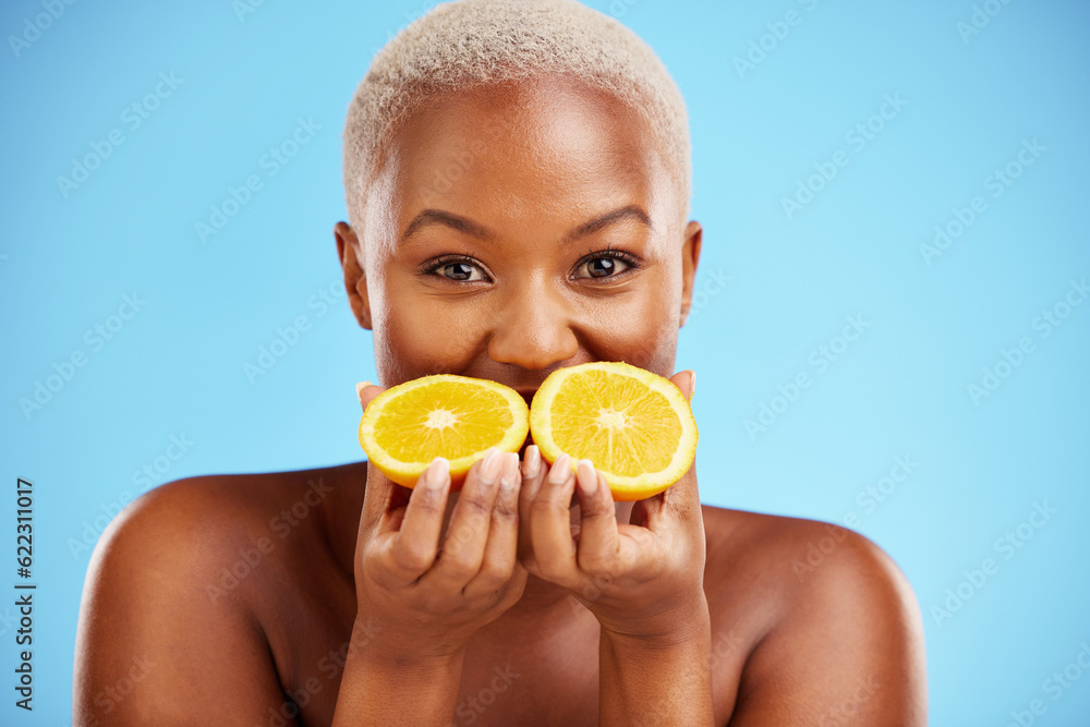 Portrait, beauty and fruit with a model black woman in studio on a blue background for natural welln