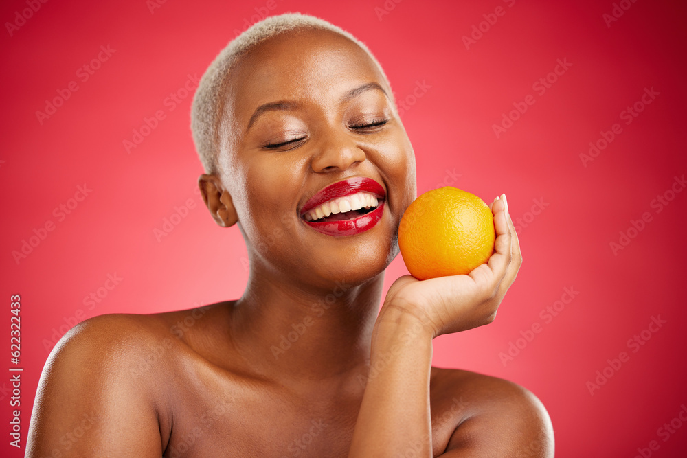 Orange, smile and black woman with natural beauty, dermatology and vitamin c on a red studio backgro