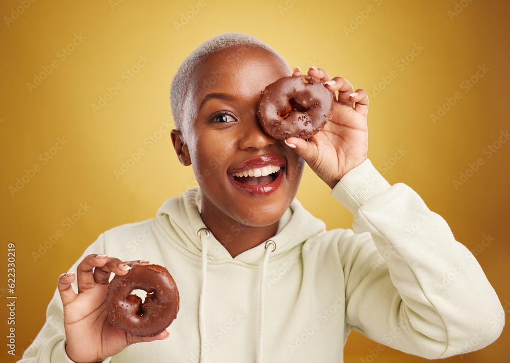 Portrait, chocolate and donut with a black woman in studio on a gold background for candy or unhealt