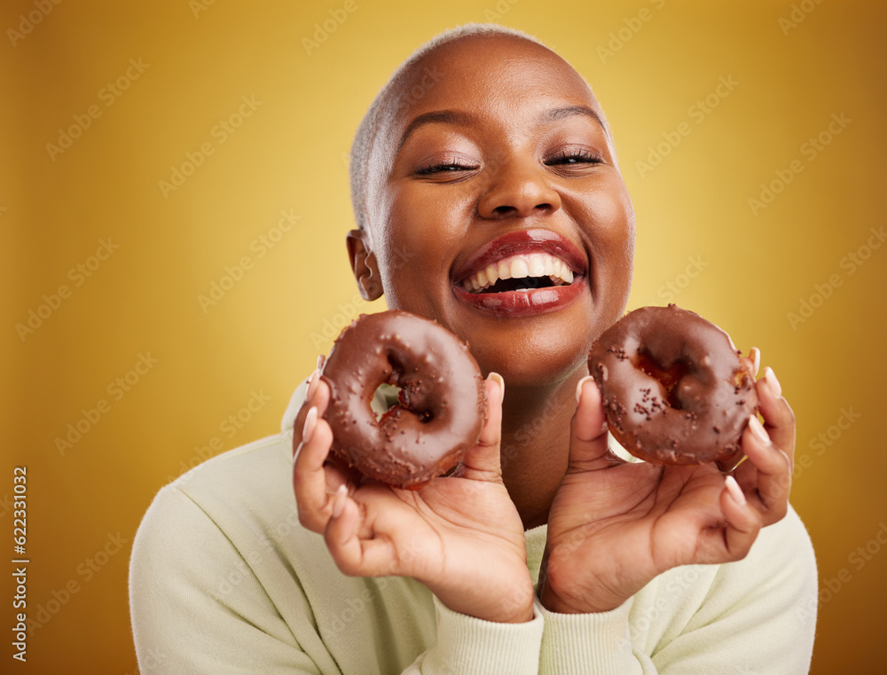 Portrait, food and donut with a black woman in studio on a gold background for candy or unhealthy ea