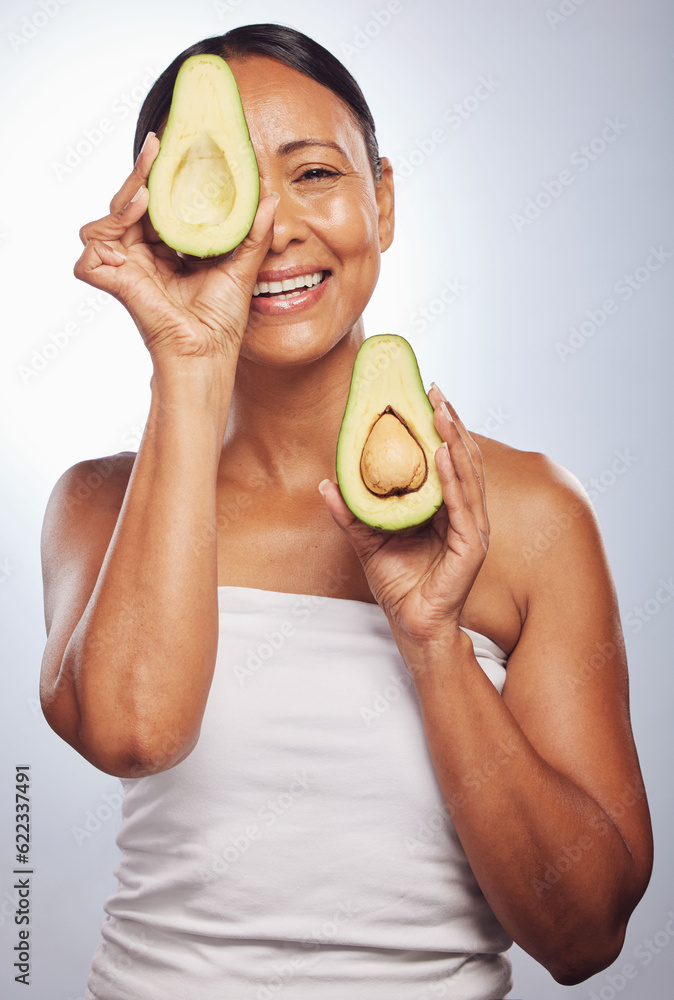 Senior, health and portrait of woman with avocado for skincare, nutrition or diet. Happy, face and e