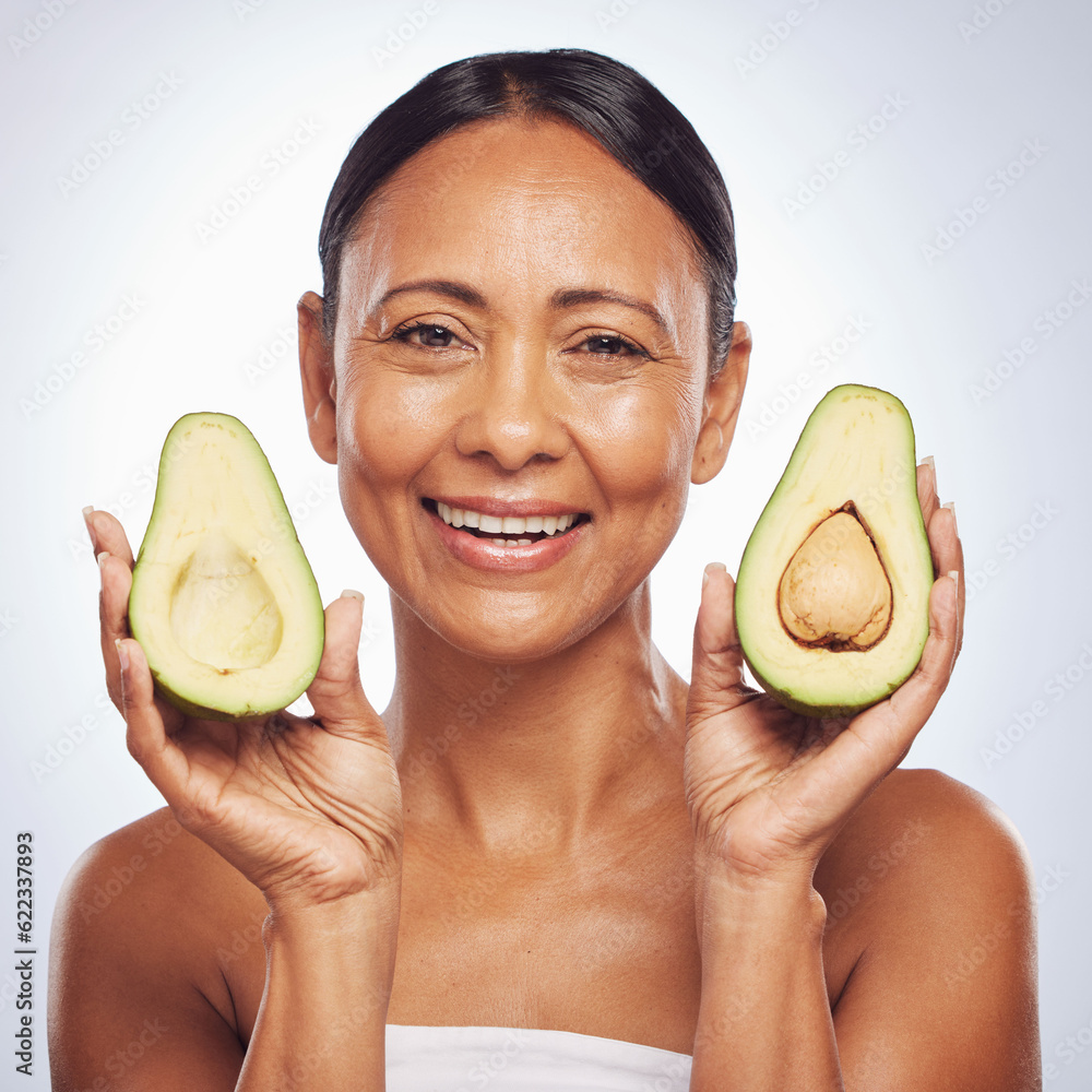 Avocado, portrait and beauty of woman in studio, white background and face glow. Happy mature model,