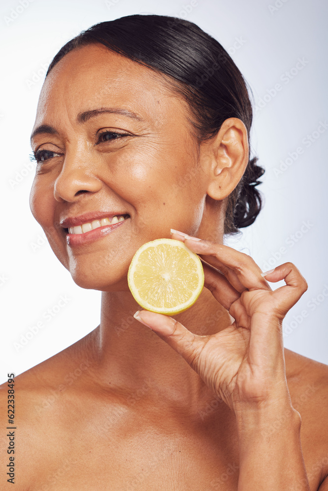 Thinking, orange and senior woman with skincare, dermatology and treatment against a white studio ba