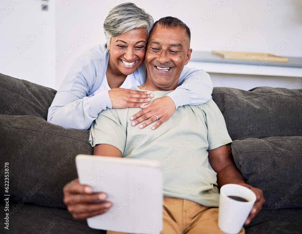 Video call, happy and senior couple with a tablet on a sofa while relaxing and bonding together. Smi