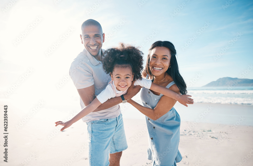 Beach, portrait and parents flying their kid on the sand by the ocean on a family vacation. Happy, s