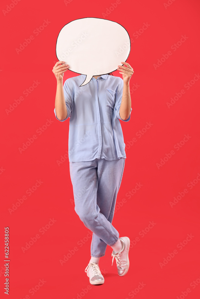 Young woman with blank speech bubble on red background