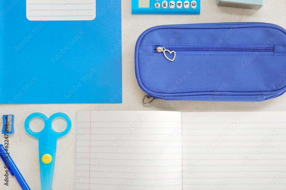 Notebooks with different stationery on white background