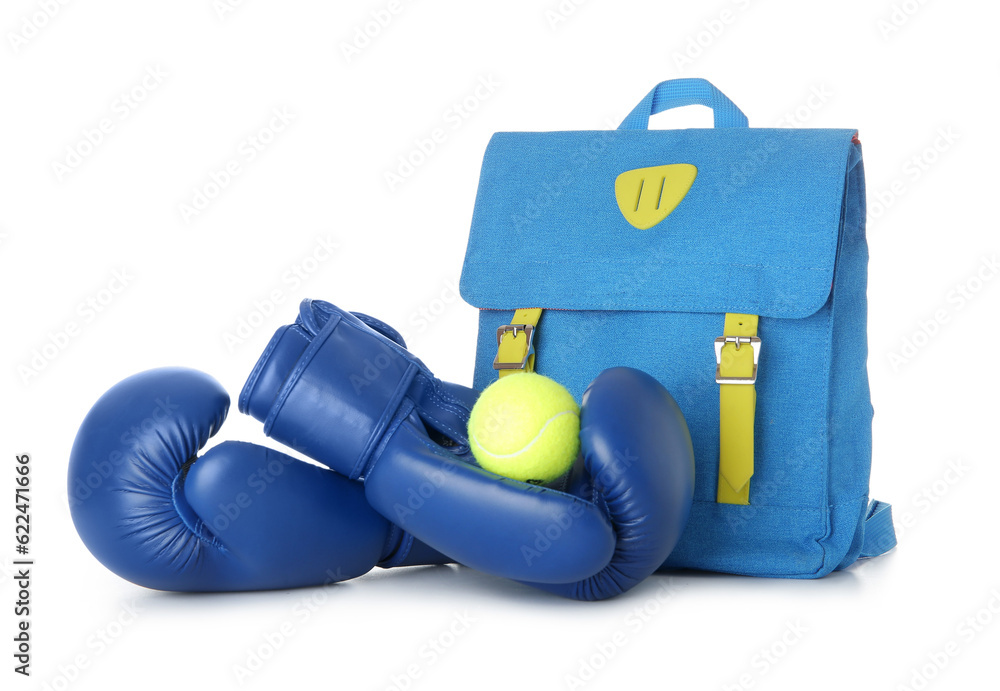 Backpack with boxing gloves and tennis ball isolated on white background