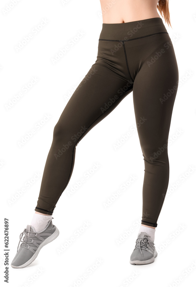 Sporty young woman in leggings on  white background