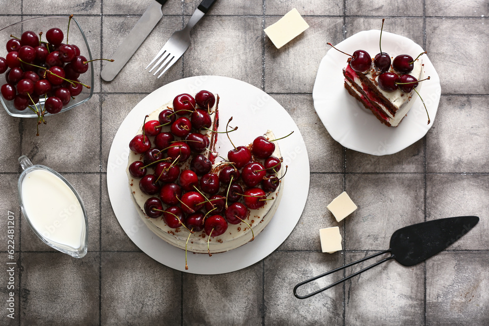 Tasty cherry cake on grey tile background