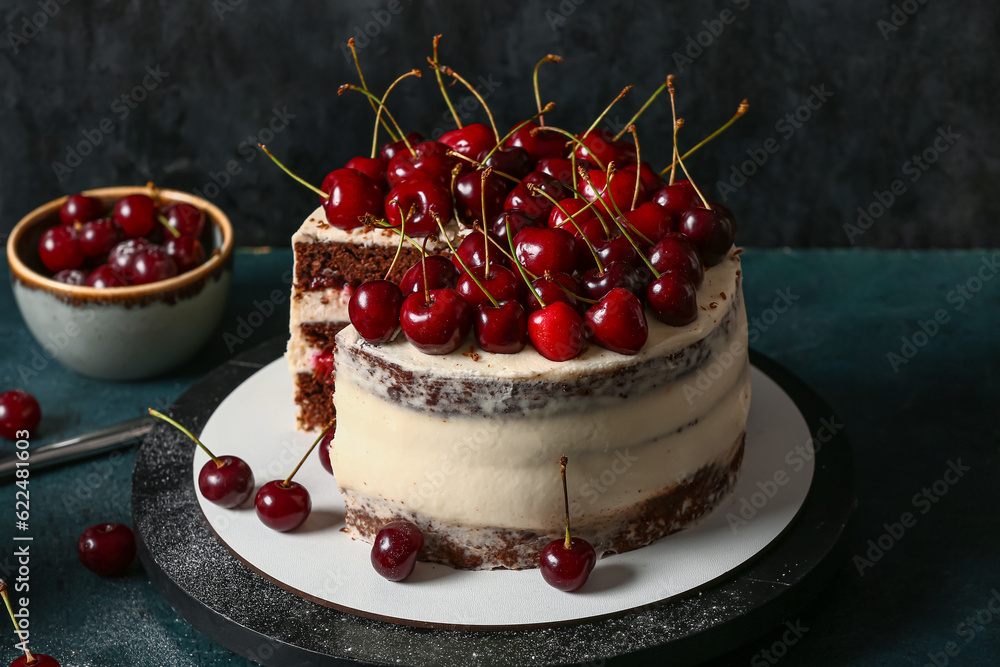 Tasty cherry cake on table