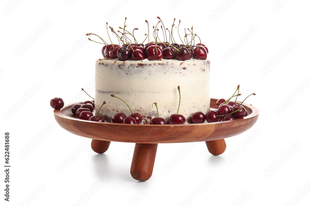 Wooden stand with tasty cherry cake isolated on white background