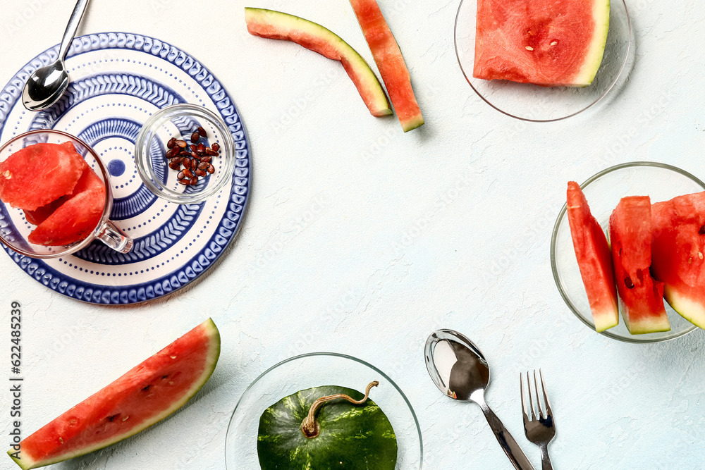 Glass bowl and cup with pieces of fresh watermelon on white background