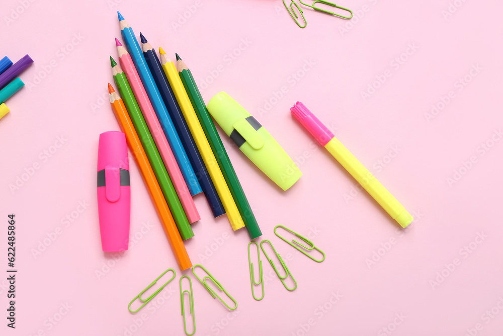 Stationery in shape of rocket on pink background