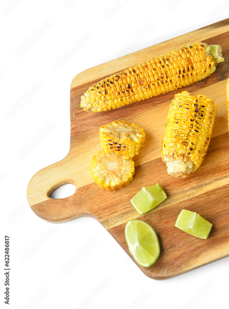 Wooden board with tasty grilled corn cobs and lime on white background