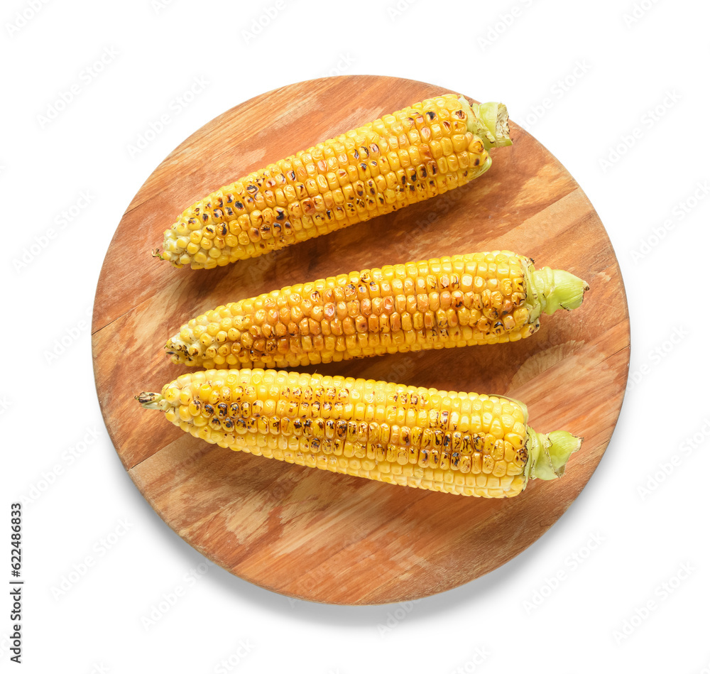 Wooden board with tasty grilled corn cobs on white background