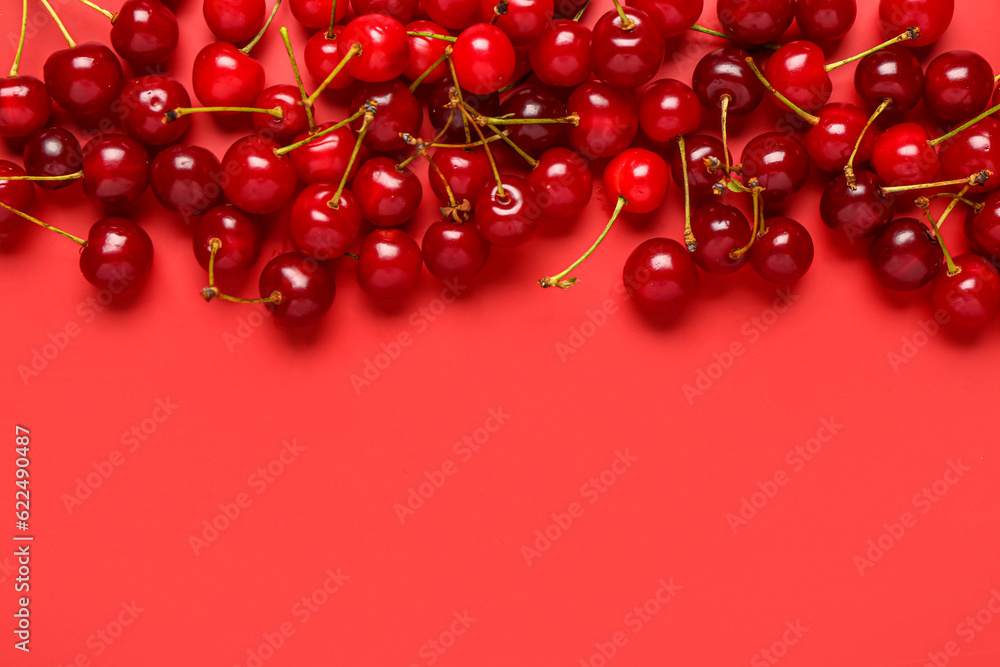 Many red sweet cherries on color background