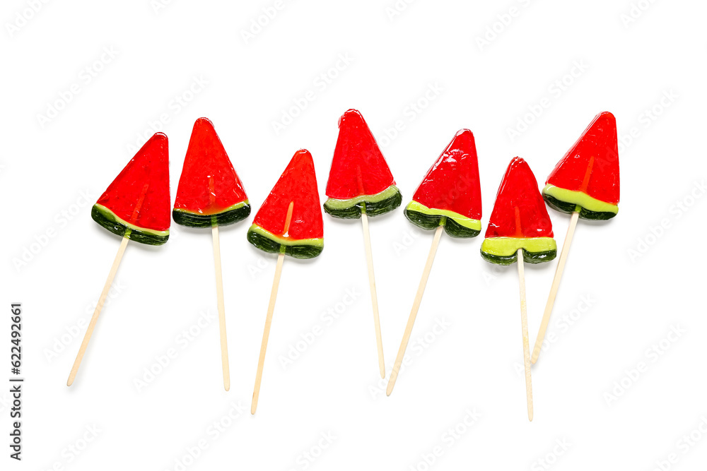 Lollipops in shape of watermelon slice on white background